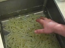 French Fries Are Soaked Within The Kitchen Sink