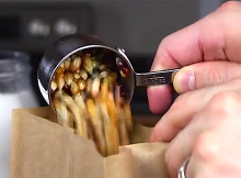 This Guy Pours Popcorn Grains In A Paper Bag