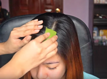 ApplyingSomethingGreentoPartinHair