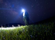 man looking at the stars and milky way, trying to count stars