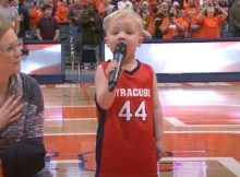 VIDE-A-little-kid-boldly-takes-the-stage-in-front-of-6000-sports-fans-to-sing-the-national-anthem…